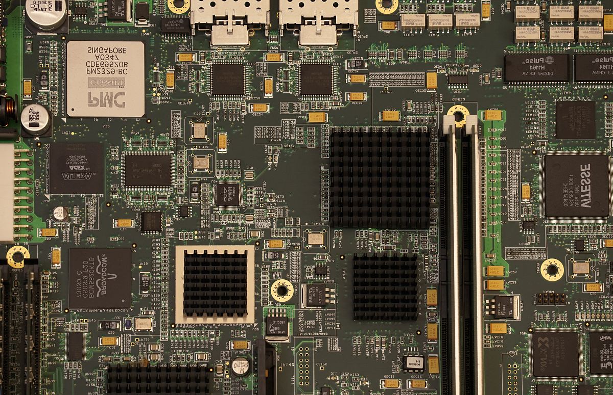 closeup photography of green and black computer motherboard